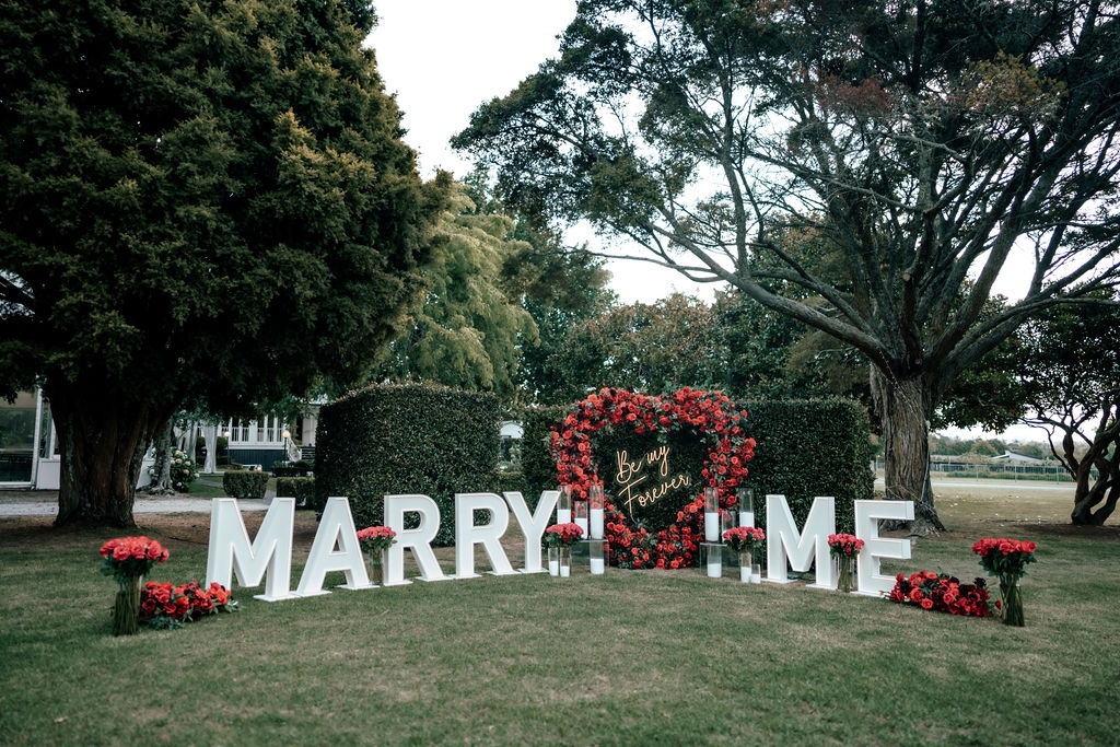 Marry Me letters and Heart arch proposal